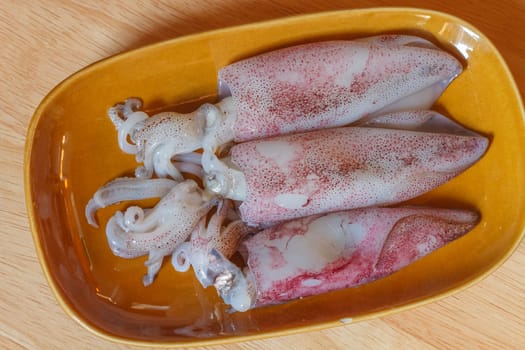 Raw squid on wooden background for cooking