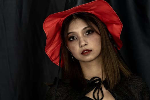 Portrait of teenager young adult girl in Halloween costume for Halloween party background