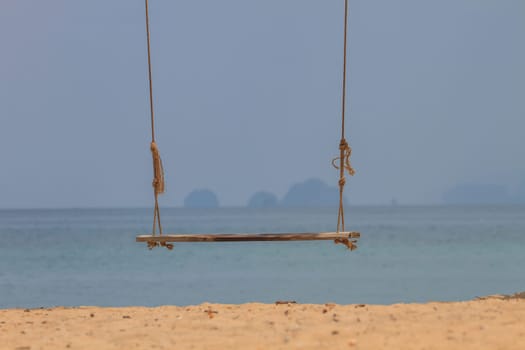 swing on beautiful tropical sea in summer, beach island and the sea in Thailand
