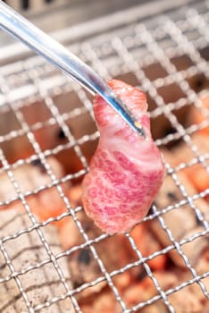 grilled japanese wagyu premium beef yakiniku with red hot charcoal