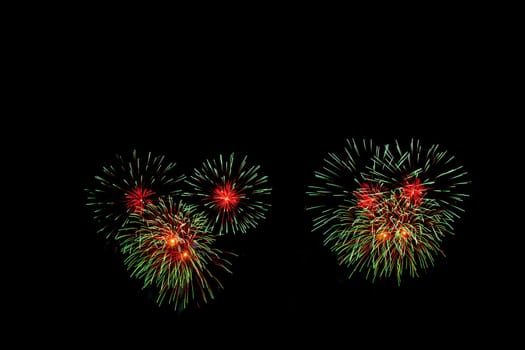 abstract Fireworks light up the dark sky background