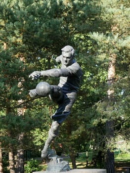 St. Petersburg, Russia, August 27, 2019 Monument to the football player Vsevolod Bobrov, soccer player kick  ball in motion