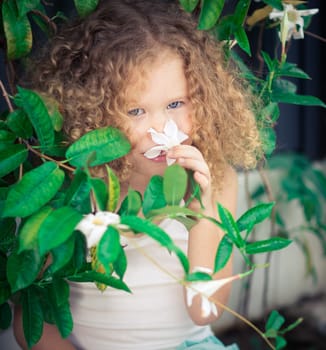 Portrait of a cute girl sitting ouddoor