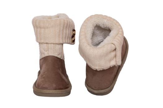 Winter boots. Close-up of a pair elegant brown suede leather winter boots with wool and lined with fur. Girls winter shoe fashion new collection. Isolated on a white background. Macro.