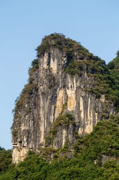 Rock mountain in the shape of a cliff on a sunny day