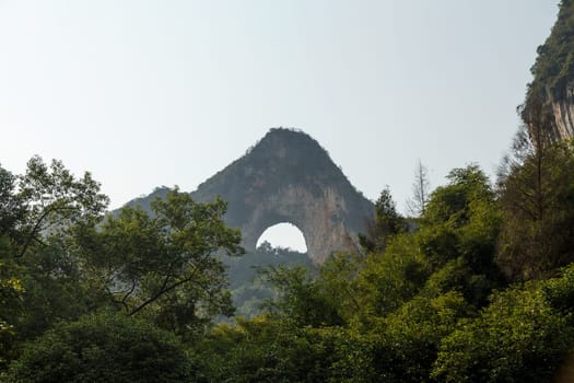 Lunar Mountain Yangshuo, China against the sky and green forest