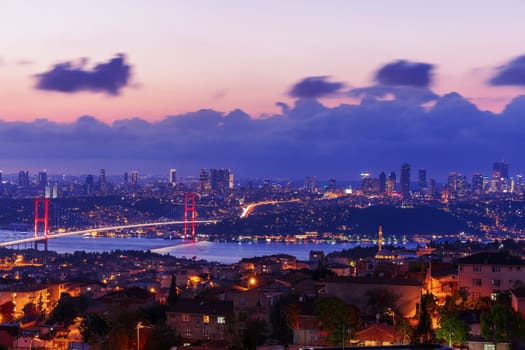 Night Bosphorus Bridge, view on Sisli and Besiktas districts of Istanbul, Turkey.