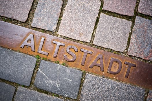 Marking the historic old town on the cobblestones of the town Schmalkalden in Thuringia with the words "Altstadt"""
