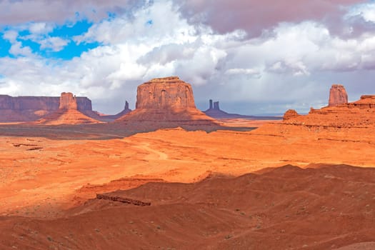 Shade and Sun in a Desert Panorama in Monument Valley Tribal Park in Arizona