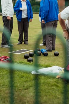 Bocce balls on a bowling green, in preparation for a lawn bowling game.