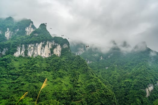 Asia longest cable car going to the top of the famous Heaven Linking Avenue or Big Gate Road Tianmen mountains, Zhangjiajie, China