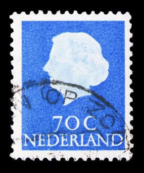 MOSCOW, RUSSIA - AUGUST 8, 2019: Postage stamp printed in Netherlands shows Queen Juliana (1909-2004), Type 'En Profile' serie, circa 1957