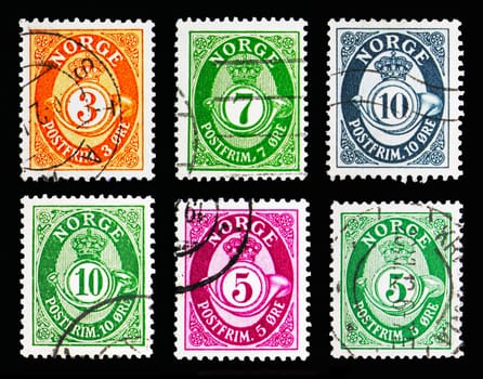 MOSCOW, RUSSIA - MAY 13, 2018: Six postage stamps printed in Norway shows Post horn - New Die serie, circa 1910-1969