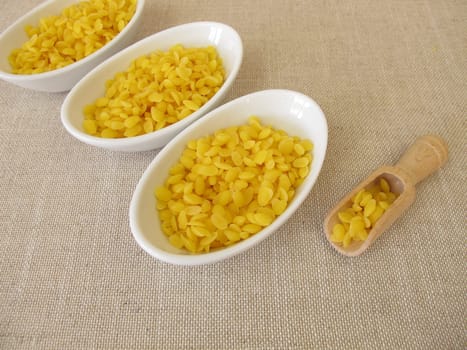Pure beeswax pastilles for natural cosmetics, candles or beeswraps