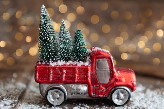 Christmas ornament on wooden background with bokeh lights