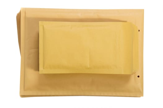 Stack of padded mailing envelopes isolated against a white background