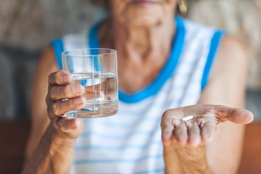 Senior woman taking her daily prescripted medication
