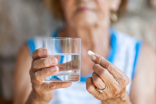 Senior woman taking her daily prescripted medication