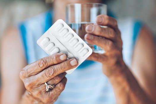 Senior woman taking her daily prescripted medication