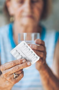 Senior woman taking her daily prescripted medication