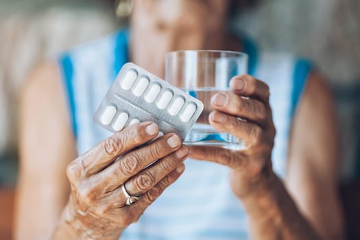 Senior woman taking her daily prescripted medication