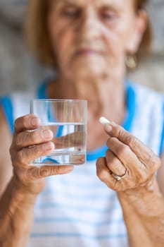 Senior woman taking her daily prescripted medication