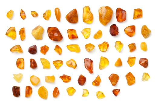 Amber isolated on white background. Collection of polished ambers. Top view, flat lay