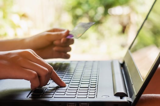 Online shopping and online banking and internet banking concept, Hand women with credit card on blurred background