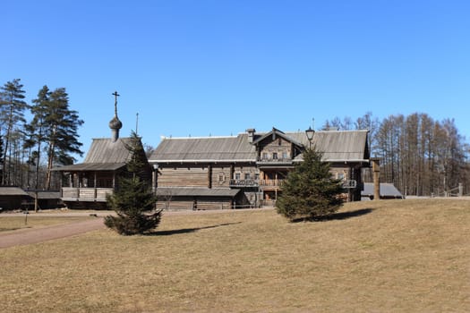 ordinary old wooden rural house  with a chapel and patch