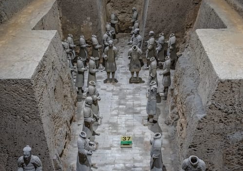 Xian, China -  July 2019 :  Standing clay soldiers forming part of an army of terracota warriors, created during the reign of first chinese emperor Qin Shi Huang Di, Shaanxi Province