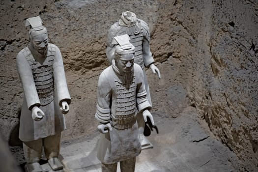 Xian, China -  July 2019 :  Standing clay soldiers forming part of an army of terracota warriors, created during the reign of first chinese emperor Qin Shi Huang Di, Shaanxi Province