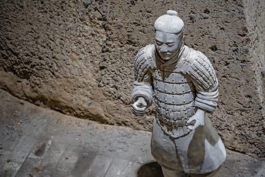 Xian, China -  July 2019 :  Standing clay soldier forming part of an army of terracota warriors, created during the reign of first chinese emperor Qin Shi Huang Di, Shaanxi Province