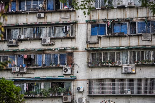 Windows and balconies of old residential buildings and blocks of flats in Chengdu, China