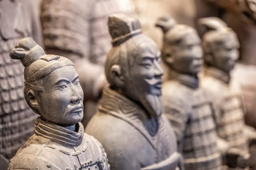 Xian, China -  July 2019 :  Souvenir mini small figurines of the clay soldiers of the army of terracota warriors for sale in a gift shop, Shaanxi Province