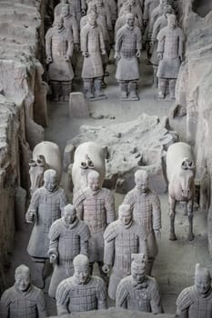 Xian, China -  July 2019 :  Standing clay soldiers forming part of an army of terracota warriors, created during the reign of first chinese emperor Qin Shi Huang Di, Shaanxi Province