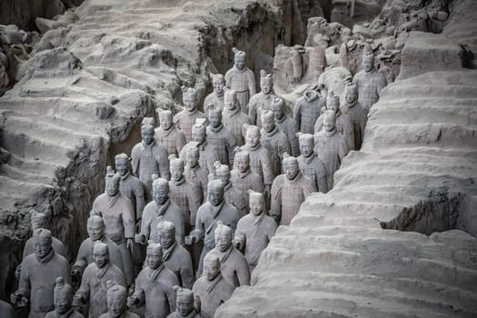 Xian, China -  July 2019 :  Standing clay soldiers forming part of an army of terracota warriors, created during the reign of first chinese emperor Qin Shi Huang Di, Shaanxi Province