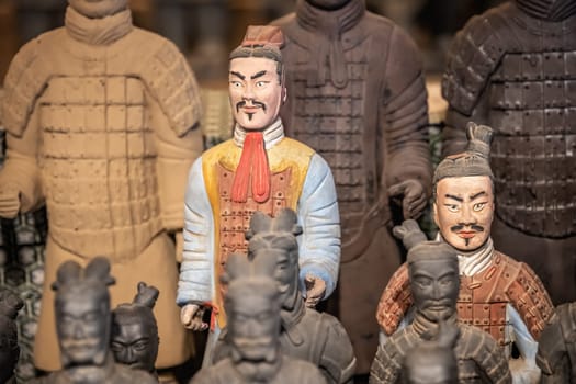 Xian, China -  July 2019 :  Souvenir mini small figurines of the clay soldiers of the army of terracota warriors for sale in a gift shop, Shaanxi Province