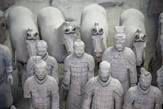 Xian, China -  July 2019 :  Standing clay soldiers forming part of an army of terracota warriors, created during the reign of first chinese emperor Qin Shi Huang Di,Shaanxi Province