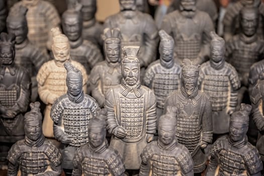 Xian, China -  July 2019 :  Souvenir mini small figurines of the clay soldiers of the army of terracota warriors for sale in a gift shop, Shaanxi Province