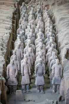 Xian, China -  July 2019 :  Standing clay soldiers forming part of an army of terracota warriors, created during the reign of first chinese emperor Qin Shi Huang Di, Shaanxi Province