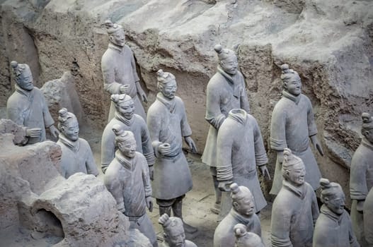Xian, China -  July 2019 :  Standing clay soldiers forming part of an army of terracota warriors, created during the reign of first chinese emperor Qin Shi Huang Di,Shaanxi Province