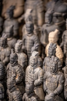 Xian, China -  July 2019 :  Souvenir mini small figurines of the clay soldiers of the army of terracota warriors for sale in a gift shop, Shaanxi Province