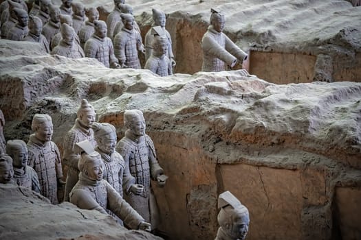 Xian, China -  July 2019 :  Standing clay soldiers forming part of an army of terracota warriors, created during the reign of first chinese emperor Qin Shi Huang Di,Shaanxi Province