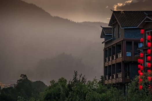 Wulingyuan, China -  August 2019 : Red lanterns of hotels, shops and restaurants in Wulingyuan during rainy sunset