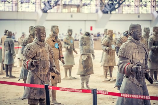 Xian, China -  July 2019 : Standing clay soldiers forming part of an army of terracota warriors, created during the reign of first chinese emperor Qin Shi Huang Di, Xian, Shaanxi Province