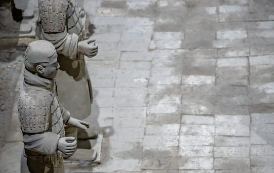 Xian, China -  July 2019 :  Standing clay soldiers forming part of an army of terracota warriors, created during the reign of first chinese emperor Qin Shi Huang Di, Shaanxi Province