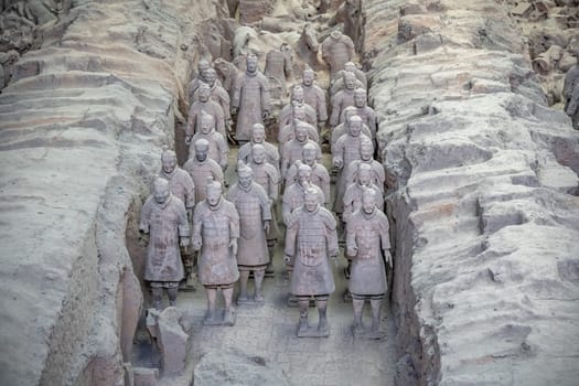 Xian, China -  July 2019 :  Standing clay soldiers forming part of an army of terracota warriors, created during the reign of first chinese emperor Qin Shi Huang Di,Shaanxi Province