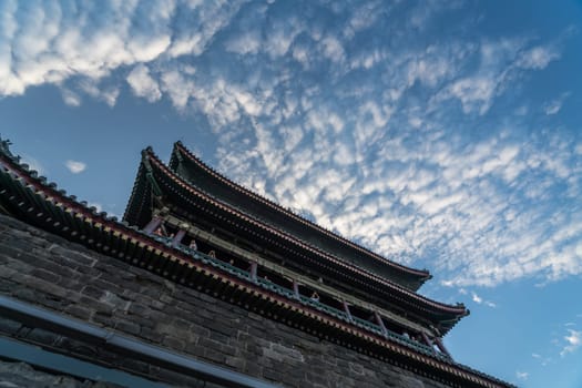 Xian, China -  July 2019 : People looking down from the balconies of the landmark Drum Tower in the city Xian, Shaaxi Province, Central China