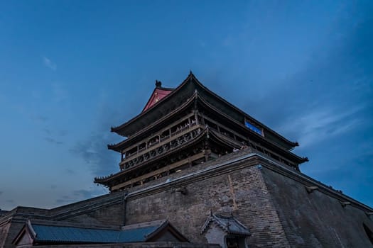 Xian, China -  July 2019 : Landmark Xian Bell Drum Tower photographed at dusk, Shaaxi Province