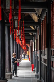 Chengdu, China -  July 2019 : Female chinese tourist sightseeing the popular Wenshu Monastery